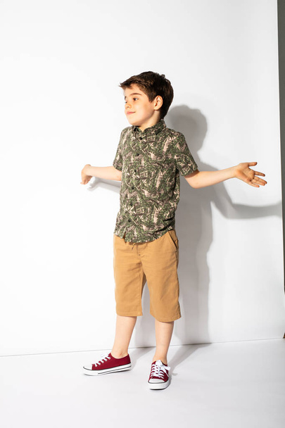 young boy posing on white background - Φωτογραφία, εικόνα