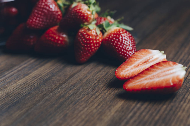 fresh strawberries on old wooden table - Foto, afbeelding