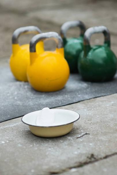 Sport equipment in gym. kettle bell on floor - Photo, Image