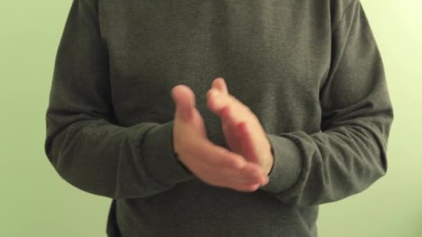 Man wearing a brown sweater applauds. Hands close up. Concept of approval, success. - Footage, Video