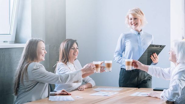 cheers business ladies celebrating clinking latte - Valokuva, kuva