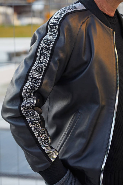 Man with black leather Philipp Plein jacket before Neil Barrett fashion show, Milan Fashion Week street style  - Fotó, kép