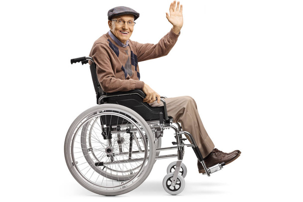 Senior disabled man waving from a wheelchair - Foto, afbeelding