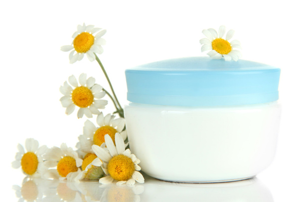 Cosmetic cream with wild camomiles, isolated on white - 写真・画像