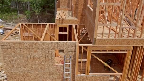 Building construction, wood framing structure at new property development site - Footage, Video