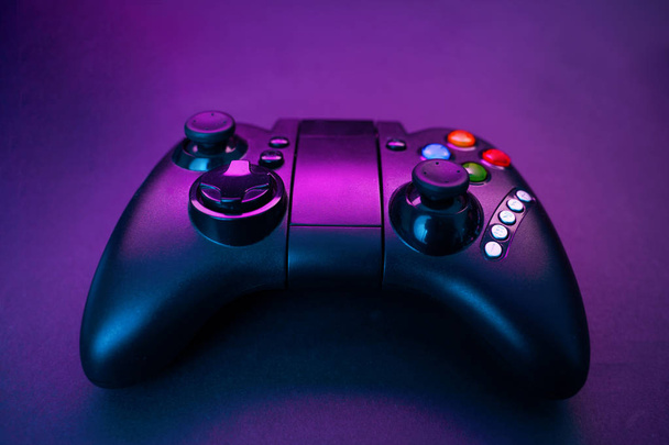 Gamepad on violet table background. - Photo, Image