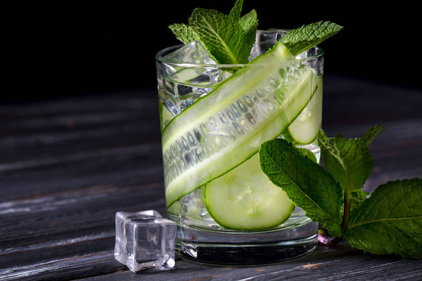 Infused cucumber drink with mint. Detox water.Selective focus - 写真・画像
