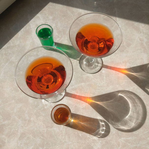 alcohol cocktails with long shadow, top view - Photo, Image