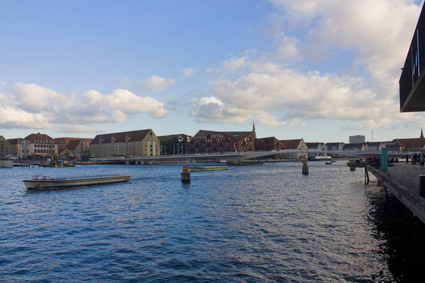 COPENHAGEN, DENMARK - May 25, 2019: Modern drawbridge near Nyhavn pier in Copenhagen - Fotó, kép
