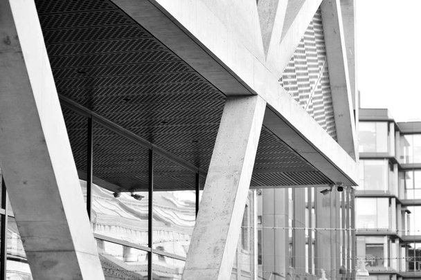 Modern architecture detail. Refined fragment of  office building. Concrete cellular structure.Contemporary office building. Abstract lines on architecture. Black and white. - Photo, Image