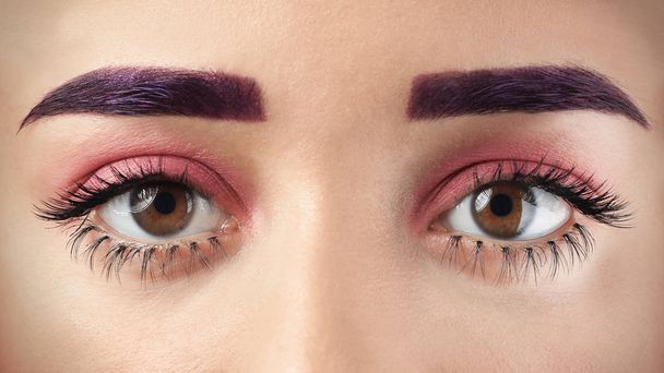 Young woman with dyed eyebrows and creative makeup, closeup - Foto, Imagen