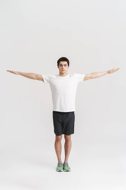 Full length portrait of a healthy fit young sportsman - Fotografie, Obrázek