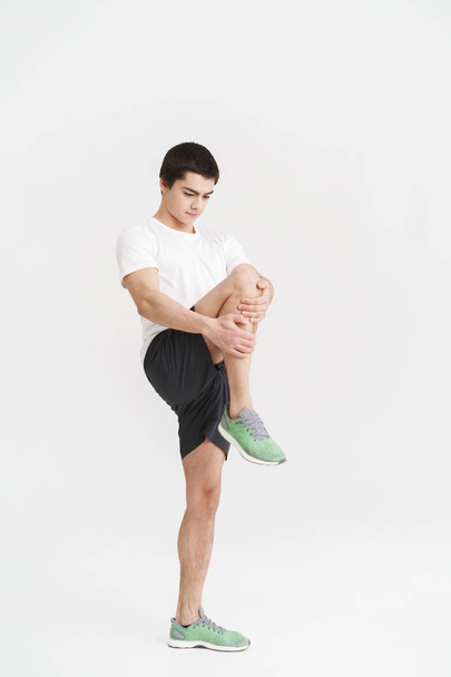 Full length portrait of a healthy fit young sportsman - Фото, изображение