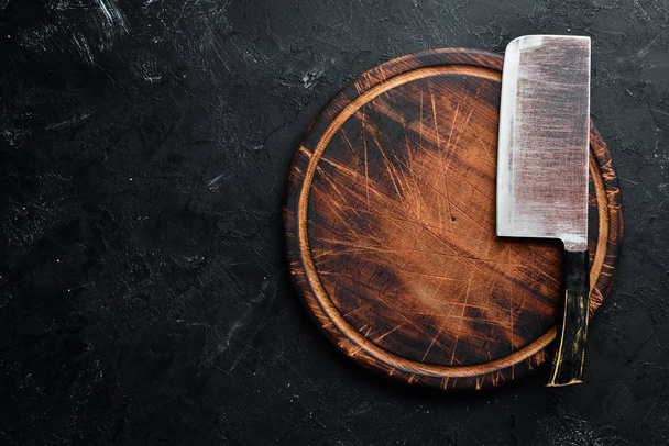 The old kitchen knife and Wooden boards on a black background. Top view. Free space for your text. - Foto, immagini
