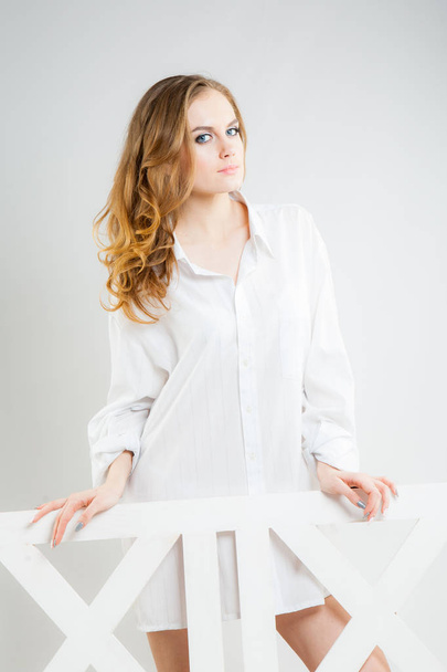 young beautiful woman in a white men's shirt  - Φωτογραφία, εικόνα