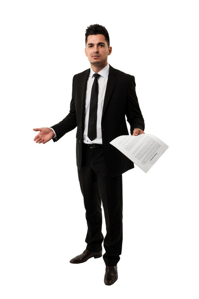 Tall businessman waiting for a client to sign a contract - Foto, imagen