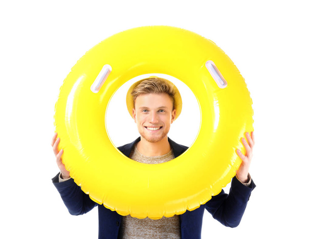 Funny young tourist with inflatable ring on white background - Foto, Imagem