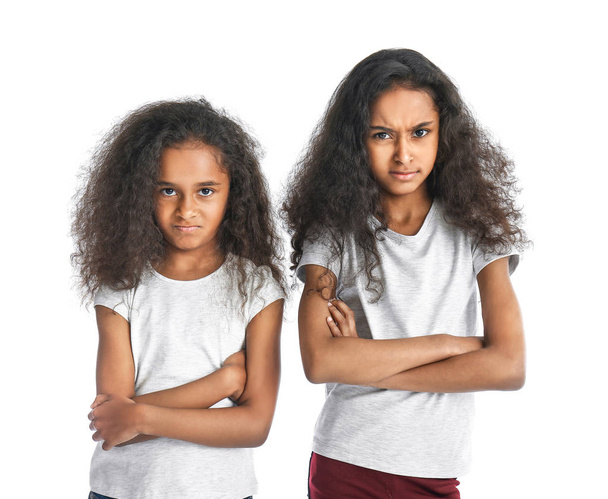 Offended African-American girls on white background - Foto, imagen