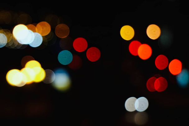 colorful bokeh lights in the street in the city at night - Fotoğraf, Görsel