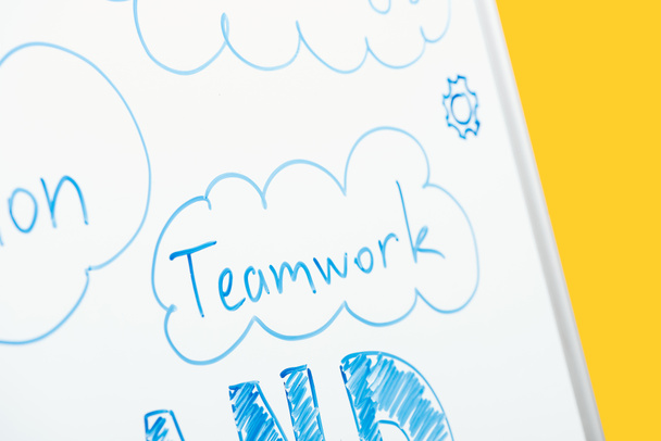 close up view of word teamwork written on white flipchart - Fotó, kép