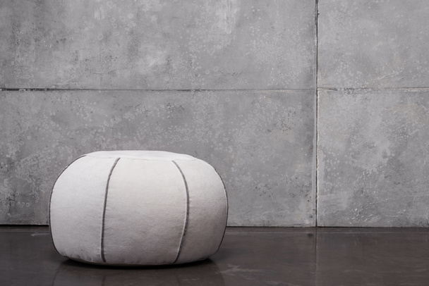 soft round shape padded stool on grey with copy space  - Foto, Bild