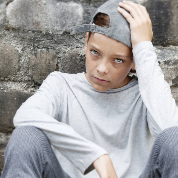 Sad teen outdoors - Фото, изображение