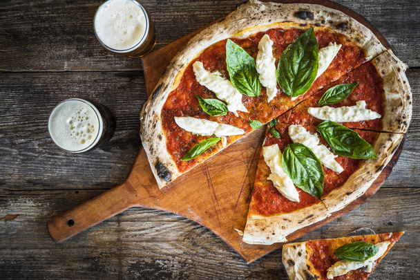 diced pizza of basil, tomato sauce and cheese - Фото, зображення
