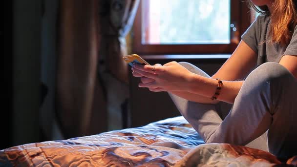 woman phone bed window background hd footage  - Záběry, video