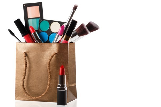 Different makeup objects in shopping bag - Photo, Image