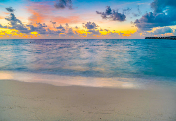 Beautiful water villas in tropical Maldives island at the sunset - Фото, изображение