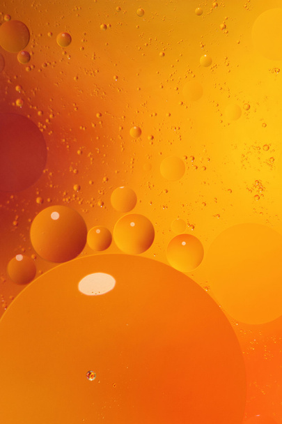 Abstract orange background with bubbles in the water - Фото, изображение