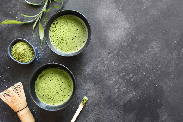 Still life with Japanese matcha green tea on black table. Top vi - Foto, Imagem