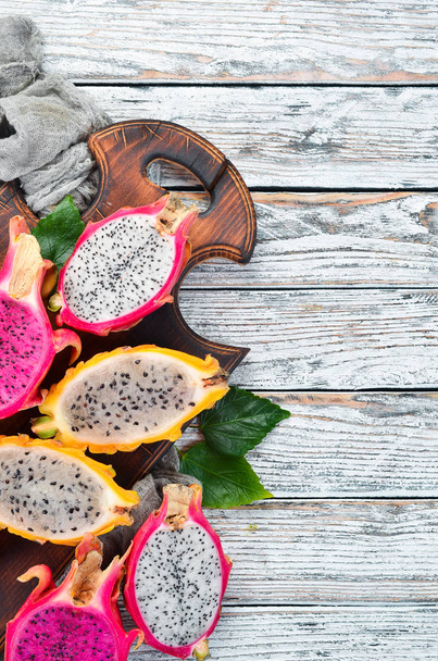 Fruit dragon on a white wooden background. Tropical Fruits. - 写真・画像
