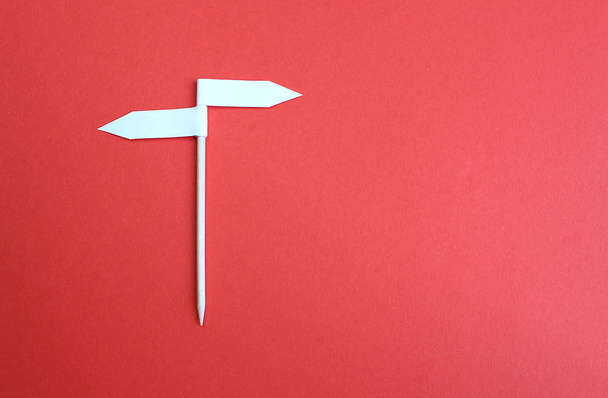 Two side arrow sign background made of paper - 写真・画像
