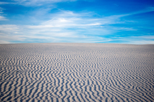 Beautiful desert landscape under blue cloudy sky - Photo, Image