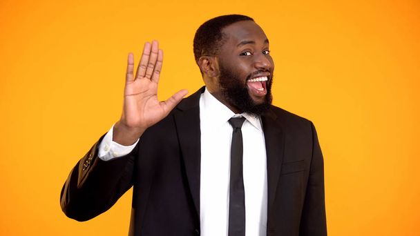 Joyful childish afro-american sales manager waving hello, promo campaign, ad - Foto, immagini