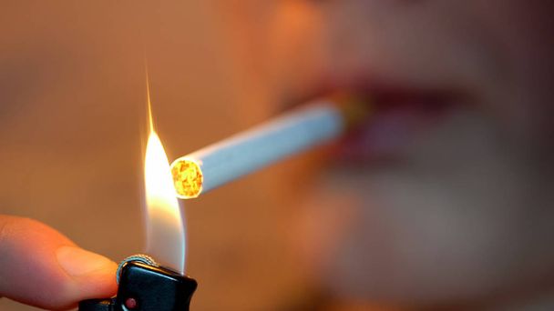 Young male smoking cigarette, nicotine addiction, harmful unhealthy habit - Фото, зображення