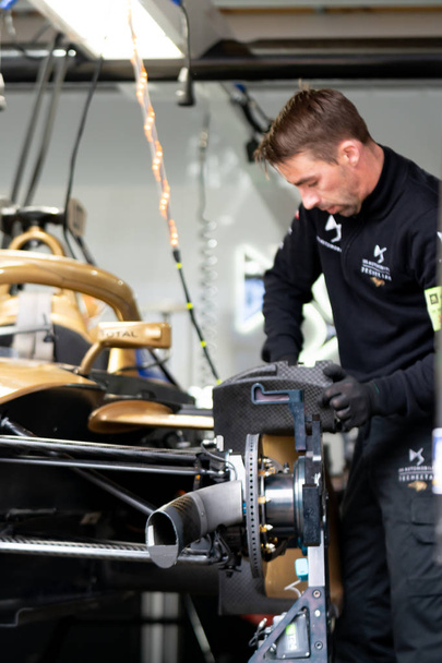 Berlin, Germany - May 25, 2019: DS Automobiles mechanic checking a racing electric car participating in the ABB FIA Formula E Championship - Photo, image