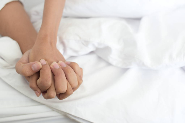 close up of a woman's hands in bed - Foto, Imagem