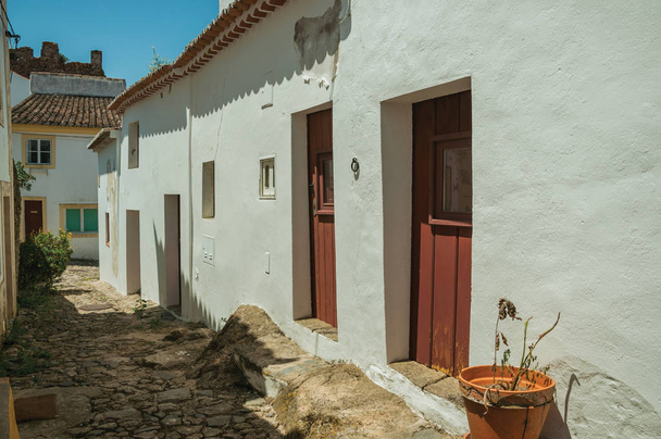 Old houses with whitewashed wall and wooden door - Photo, Image