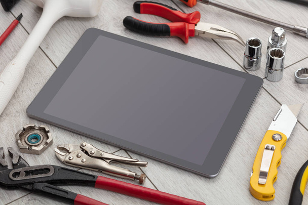 Household tools and tablet with empty screen  - Valokuva, kuva