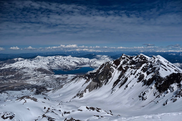 Panoramic view of Mount St Helens crater with Spirit lake and Mount Rainier in distance. Mount St Helens National Volcanic Monument. Washington. United States of America. - Photo, Image