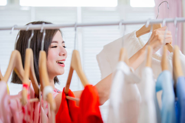 woman choosing clothes at home - Foto, imagen