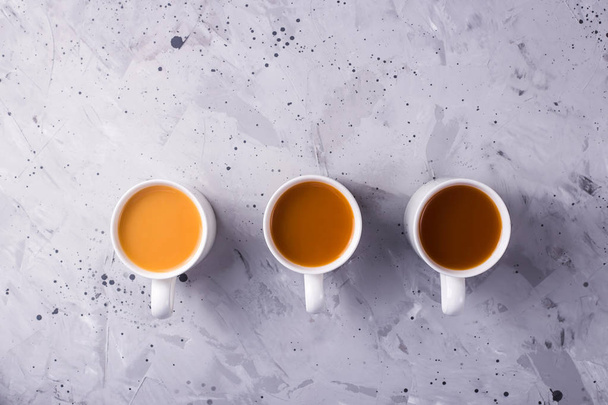 Masala tea or coffee with a different amount of milk and a diffe - Fotoğraf, Görsel