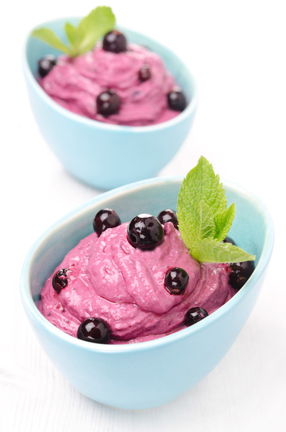 blackcurrant mousse with cream cheese in blue bowls - Фото, изображение