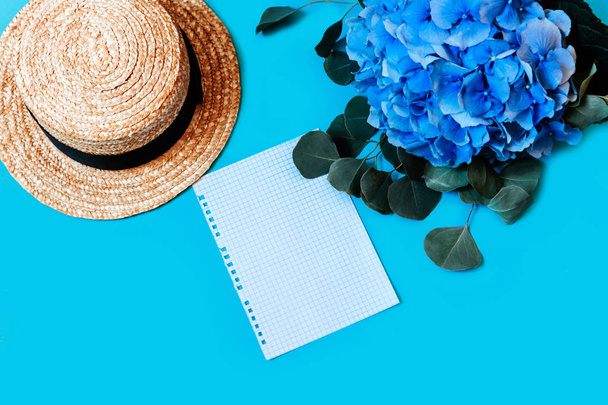 blue hydrangea top view background leaves bouquet hat camera photo pad notepad page teared riped - Photo, Image