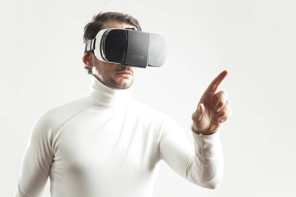 Man wearing virtual reality goggles - Fotó, kép