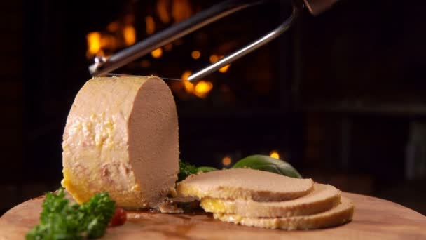 Special knife cuts a slice of foie gras - Felvétel, videó