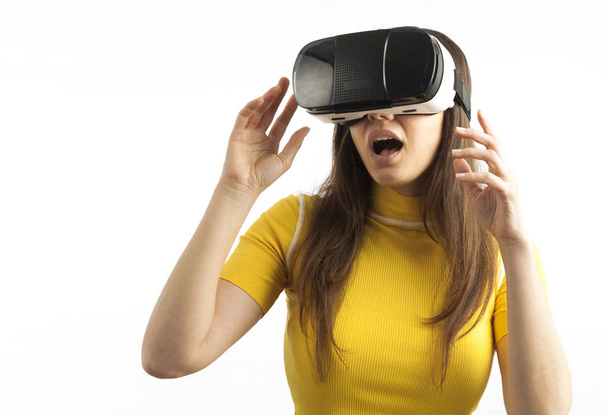 Young woman using a virtual reality headset  - 写真・画像