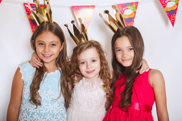 Group of funny kids celebrate birthday party together - Valokuva, kuva